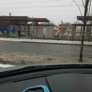 Train stop nearby and a parking lot.