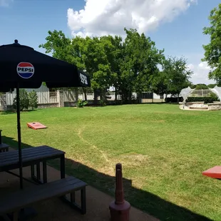 Outback, large space, picnic tables to the left.