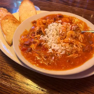 a bowl of soup and bread