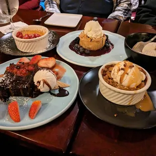 Creme brulee, blackberry/blueberry pie/sour cream ice cream, apple crumble/ vanilla ice cream, chocolate cake with strawberries.