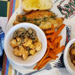 Broiled Seafood Sampler with Sweet Potato Fries.