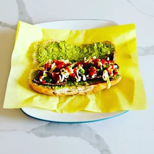 a hot dog with toppings