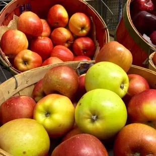 a variety of apples in baskets