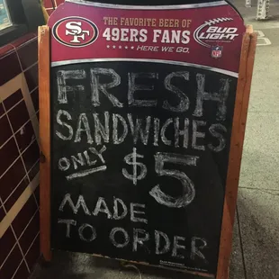 a sign for fresh sandwiches