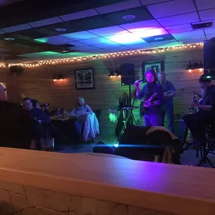 a band playing at a bar