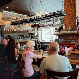 people sitting at a bar