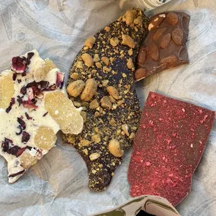 White chocolate ginger hibiscus  Dark chocolate cashew green chile lemongrass Milk chocolate almond  Raspberry chipotle milk chocolate