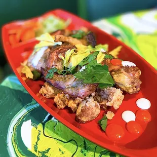 Buffalo Everything w/ wings, crispy livers, gizzards, hearts, feet | $16
