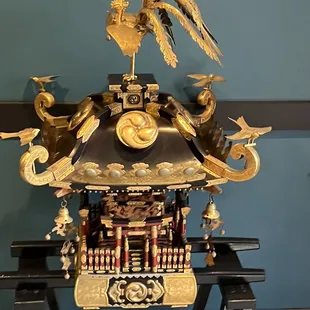a clock on a stand in a room