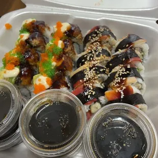 listed all sushi we got not sure which are which Firecracker Anniversary Roll Alaska Roll south pacific roll spicy crunchy tuna