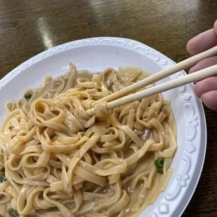 Yellow noodles in Peanut sauce