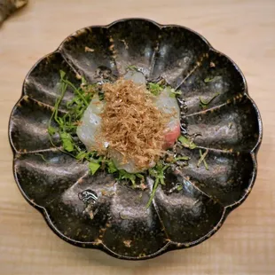 a plate of food on a wooden table