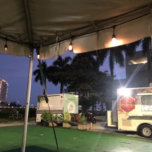 a food truck parked under a tent