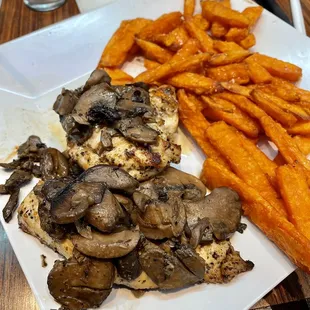 Grilled Chicken with mushrooms and a side of sweet potato fries
