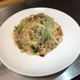 a plate of stir fried noodles