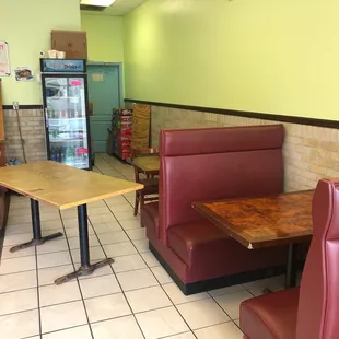 a restaurant with booths and tables