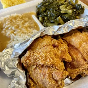 Friend chicken with sides of Collard Greens and Rice with gravy