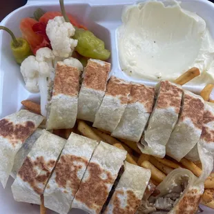 This is the Chicken Shawarma Plate. Essentially it&apos;s meat inside of a tortilla with a glob of mayonnaise.