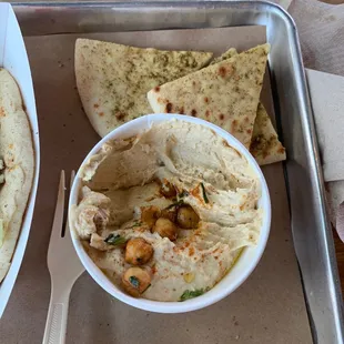 Hummus and pita. Had to take a few bites because it was so good