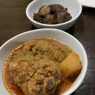 two bowls of food on a table