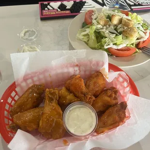 Half Hot Gold and half Suicide wings with a house salad with ranch.