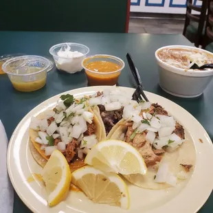 Taco Tuesday Trio of their Signature Al Pastor, Asada, and Carnitas Soft Tacos served with Refried Beans, Chips, and  Mild and Hot Salsas!