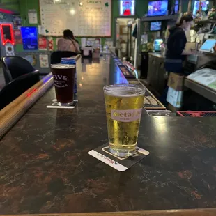 a pint of beer on the bar