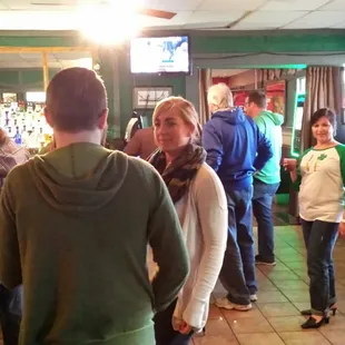 a group of people in a bar