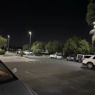 Parking lot filled with cars after closing