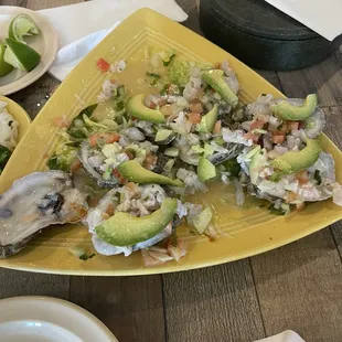 Oyster with ceviche and avocado