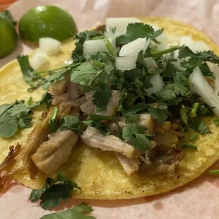 My custom taco : carnitas cilantro onion and cheese On a corn tortilla.