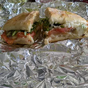 Veggie sandwich (pasta in back)