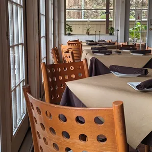 a dining room with tables and chairs