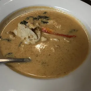 a bowl of soup with a spoon