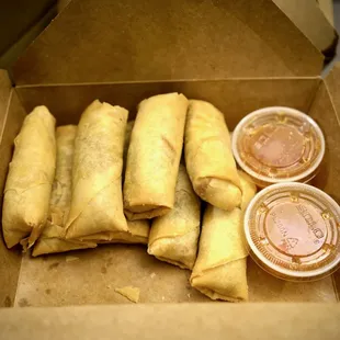 a box of fried spring rolls