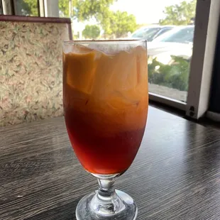 a drink in a glass on a table