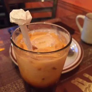 Quick stop for Thai ice Tea. Beautiful white rose straw display.