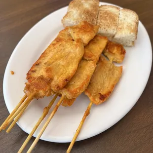 Chicken satay with toast