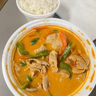 a bowl of curry and a bowl of rice