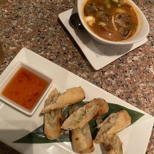 Spring rolls and some type of food