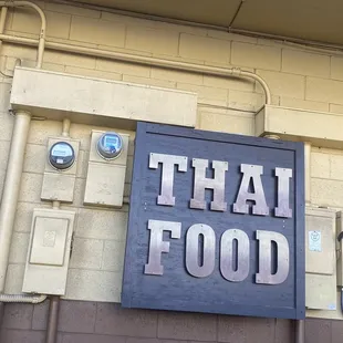 Near the door. Can't see from Dillingham Blvd, but its between Dillingham Shopping Center with Zippy &amp; Wingstop and Bob BBQ!