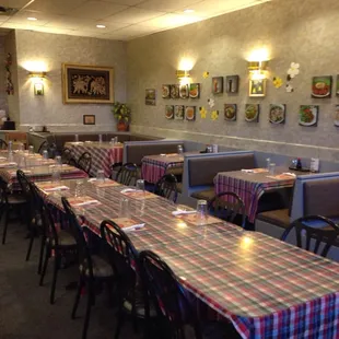 a dining area with tables and chairs
