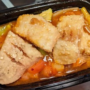 Deep-fried catfish with pineapples, green peppers, onions, and cucumbers in a sweet and sour sauce.
