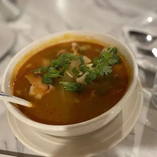 a bowl of soup with a spoon in it