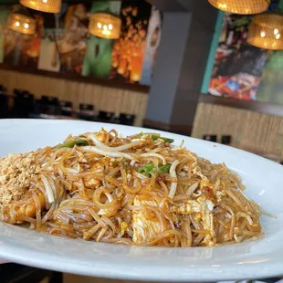 a plate of pad thai noodles