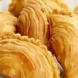 Curry Puff - Deep fried Pastry shell filled with chicken and potato