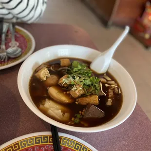 a bowl of soup and a bowl of soup on a table