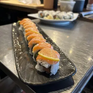 Signature Gasparilla Roll

(Salmon, avocado topped with salmon and thinly sliced lemon.)