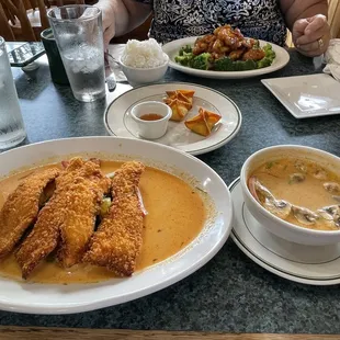 Crispy chicken over Panang curry, Tom kha, crab rangoons, orange chick