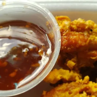 The dipping sauce container is almost bigger than the wing drummy on the right
